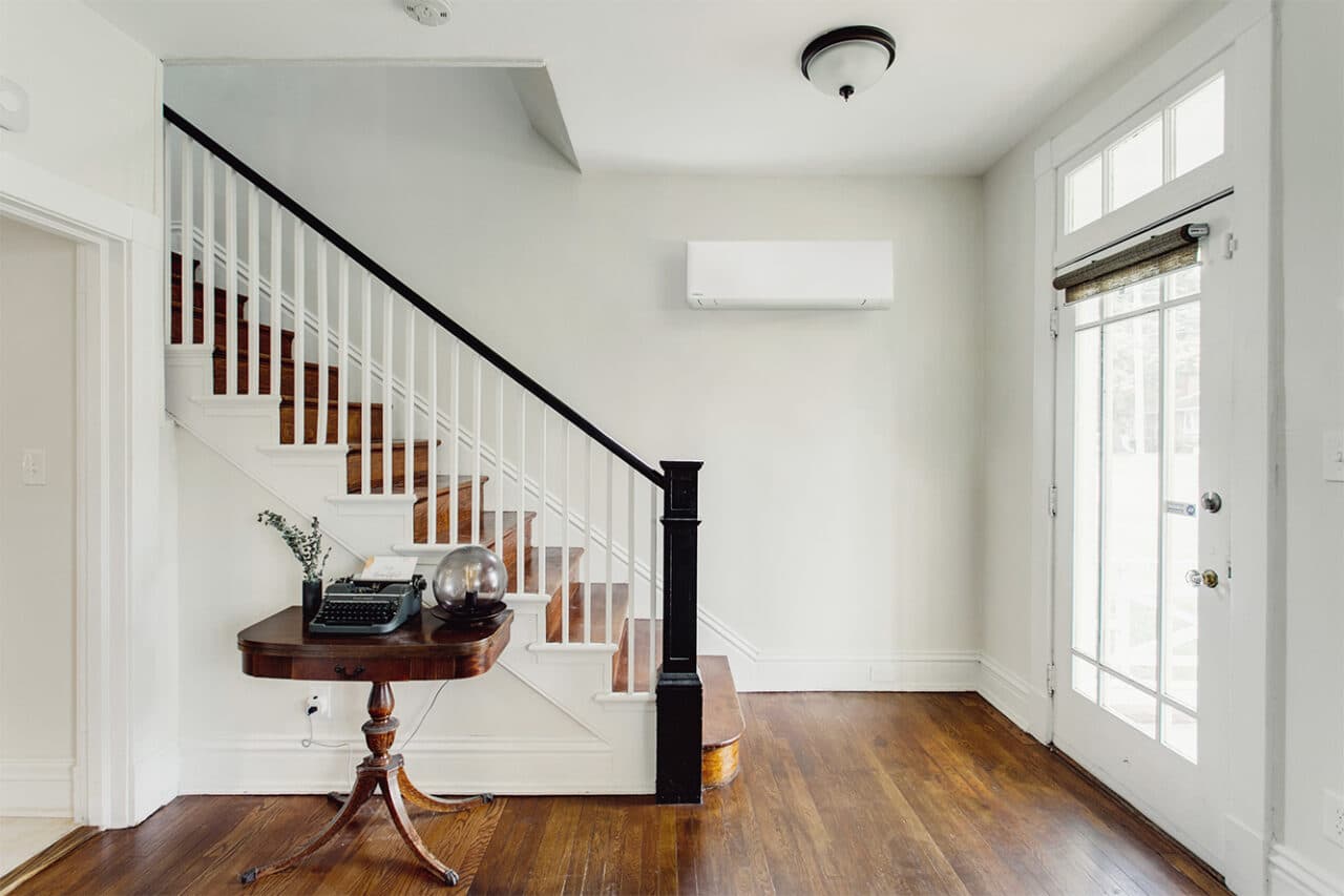White bright foyer historic with hardwood floors diamond window